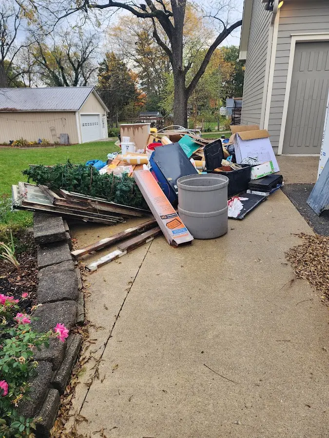 Dumpster being loaded with debris for 3 Yard Dumpster Rental in Ogden